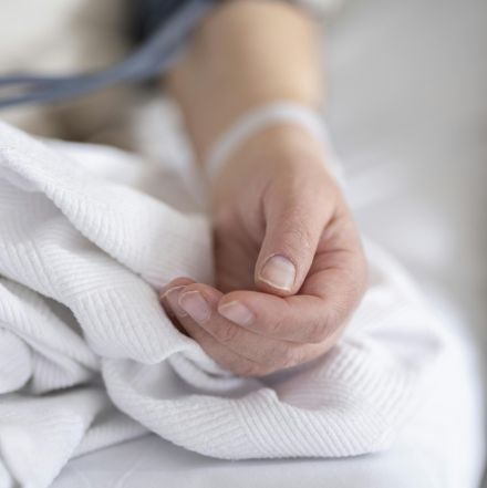 an elderly patient whose blood pressure is measured