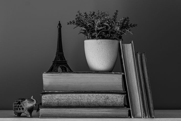 Close-up image of an open book with pages turning, creating a dynamic visual.
